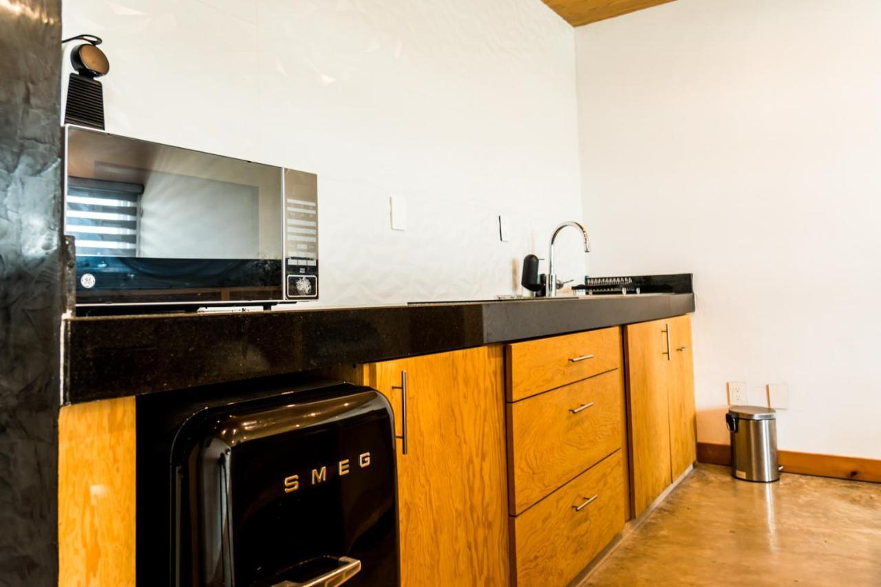 Casa Ticul Hotel Boutique - 5Th Ave (Adults Only) Плая дел Кармен Екстериор снимка A kitchen with a refrigerator, stove, and oven